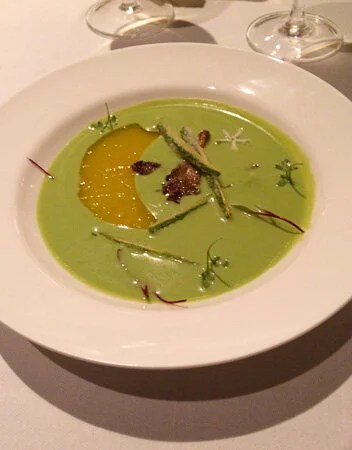 Cold pea soup with jellied orange and zucchini tempura