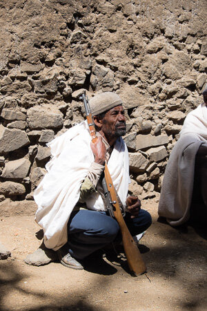 Guard at the hilltop monastery, Lalibela