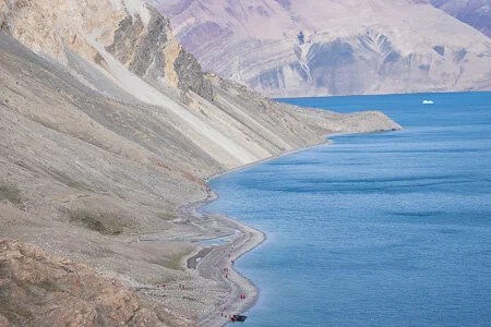  Ymer Island, highland plateau looking down on the beach below. Tiny red dots are fellow passengers walking on the beach 